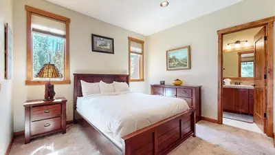 a bedroom with a bed and a sink and a mirror at Gray Stone 2088 Holiday home in Mammoth Lakes