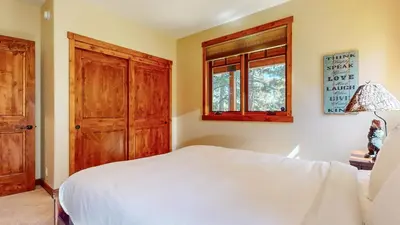 a bedroom with a white bed and a window at Gray Stone 2088 Holiday home in Mammoth Lakes