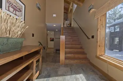 a staircase in a house with wooden steps and a window at Stonegate 5 Holiday home in Mammoth Lakes