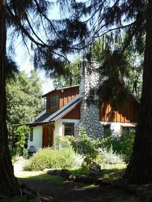 a house in the middle of some trees at Yosemite Rose Bed and Breakfast in Groveland