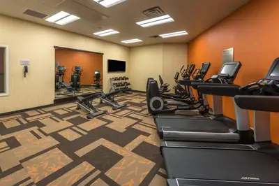 a fitness room with treadmills and cardio machines at Courtyard by Marriott Reno Downtown/Riverfront in Reno