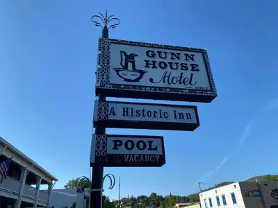 a sign for a ginn house hotel on a street at Gunn House Hotel in Sonora