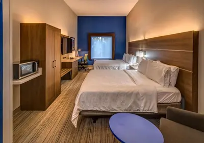 a hotel room with two beds and a tv at Holiday Inn Express Reno Airport by IHG in Reno