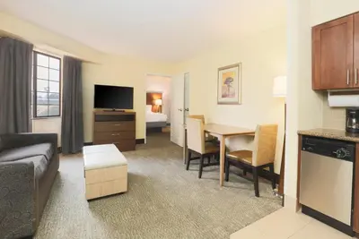 a living room with a couch and a table at Staybridge Suites Reno Nevada by IHG in Reno