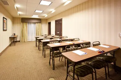 a classroom with tables and chairs in a room at Holiday Inn Express Fresno South by IHG in Fresno