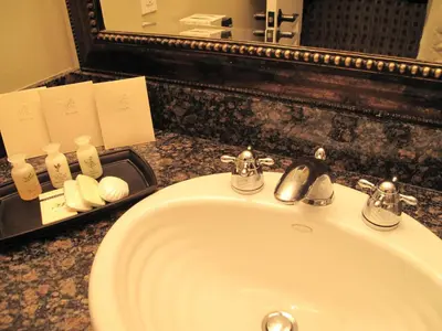 a sink in a bathroom with a mirror and a sink at Village Treehouse #1 in Mammoth Lakes