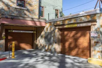 a pair of garage doors on the side of a building at Village Treehouse #1 in Mammoth Lakes