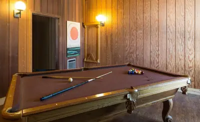 a pool table with two cue balls on top of it at Village Treehouse #1 in Mammoth Lakes