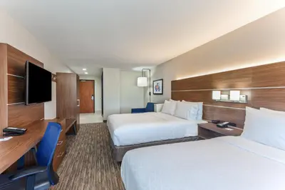a hotel room with two beds and a flat screen tv at Holiday Inn Express Elk Grove West I-5 by IHG in Elk Grove