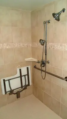 a shower in a bathroom with a shower head at Holiday Inn Express South Lake Tahoe by IHG in South Lake Tahoe