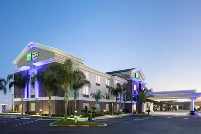 a rendering of a hotel with a parking lot at Holiday Inn Express & Suites Yosemite Park Area by IHG in Chowchilla