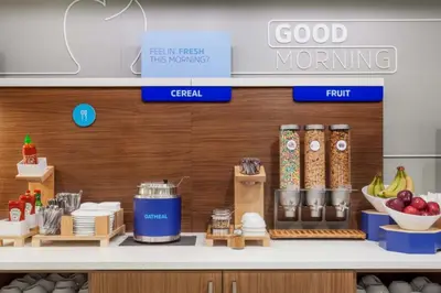 a store with a counter with food on it at Holiday Inn Express Hotel & Suites Modesto-Salida by IHG in Modesto