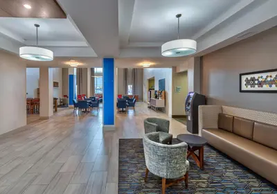 a lobby of a hospital with couches and chairs at Holiday Inn Express Hotel & Suites Minden by IHG in Minden