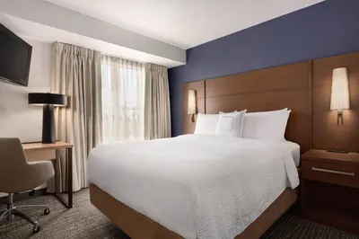 a hotel room with a large bed and a window at Residence Inn Sacramento Folsom in Folsom