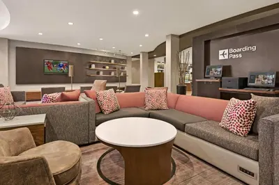 a living room with a couch and a table at Courtyard by Marriott Sacramento Folsom in Folsom