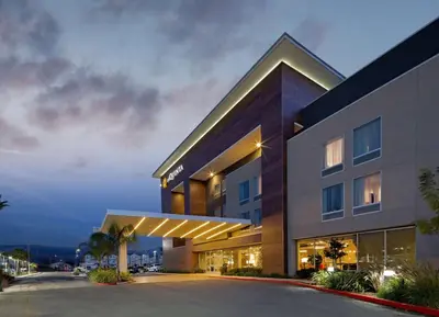 a rendering of a building with a parking lot at La Quinta by Wyndham Morgan Hill-San Jose South in Morgan Hill