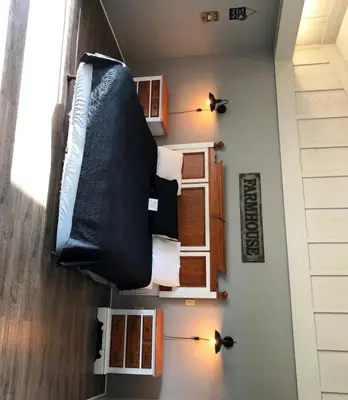 a bedroom with a bed and cabinets in a room at Ridgemark Golf Club and Resort in Hollister