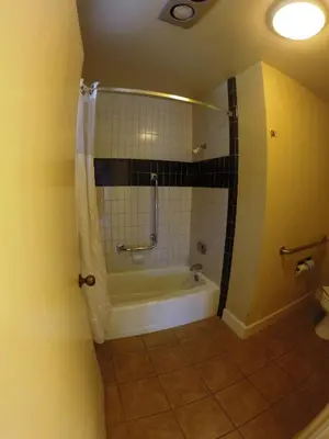 a bathroom with a shower and a bath tub at Ridgemark Golf Club and Resort in Hollister