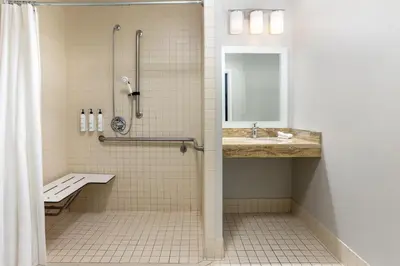 a bathroom with a shower and a sink at TownePlace Suites by Marriott Sacramento Roseville in Roseville