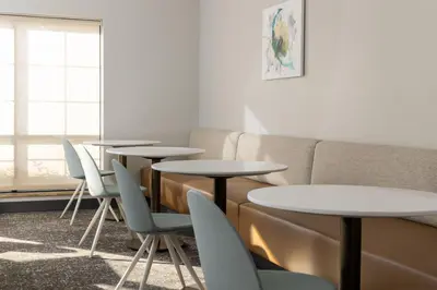 a room with tables and chairs and a couch at TownePlace Suites by Marriott Sacramento Roseville in Roseville