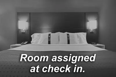 a bedroom with a bed with a room assessed at check in at Holiday Inn Express Westley by IHG in Westley