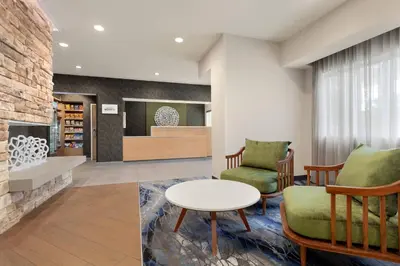 a living room with two chairs and a table at Fairfield Inn by Marriott Visalia Sequoia in Visalia