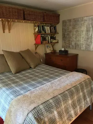 a bedroom with a bed and a dresser at Merrynook in Pinehurst