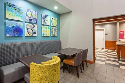 a dining room with a table and chairs at Hampton Inn & Suites Clovis Airport North in Clovis