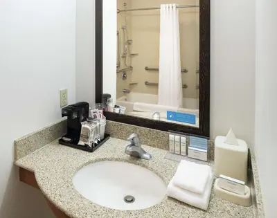 a bathroom with a sink and a mirror at Hampton Inn & Suites Clovis Airport North in Clovis