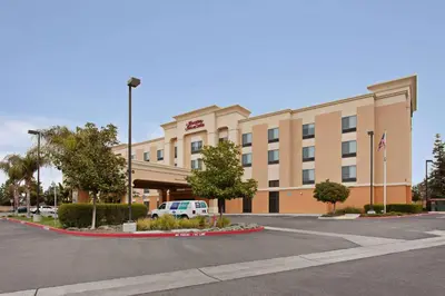 a hotel with a car parked in front of it at Hampton Inn & Suites Clovis Airport North in Clovis