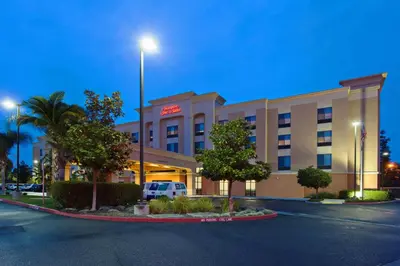 a hotel with a car parked in front of it at Hampton Inn & Suites Clovis Airport North in Clovis
