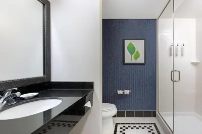 a bathroom with a sink and a toilet and a shower at Fairfield Inn and Suites Turlock in Turlock