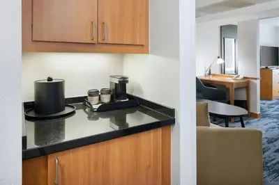 a kitchen with a counter top with a coffee maker on it at Fairfield Inn and Suites Turlock in Turlock