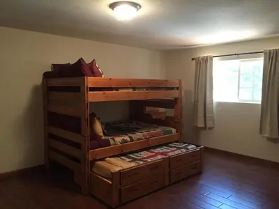 a bedroom with a bunk bed in a room at Alder Lodge in Yosemite West