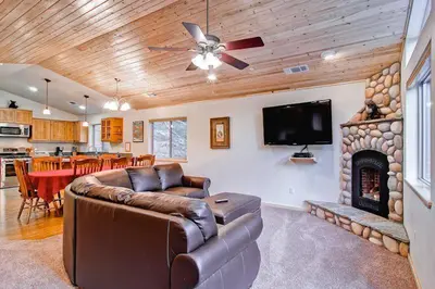 a living room with a couch and a fireplace at Explorers Retreat in Yosemite West