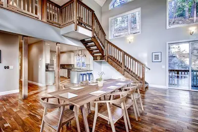 a large dining room with a table and chairs at Kildrummy Lodge in Yosemite West