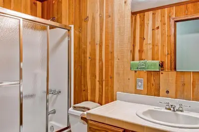 a bathroom with a shower toilet and a sink at Sport Chalet in Yosemite West