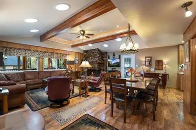 a living room with a couch and a table at Starlight Lodge in Yosemite West