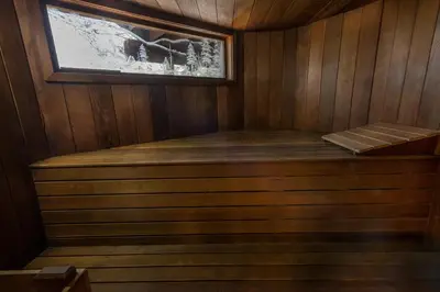 a sauna with a window in a wooden room at Four Seasons in Yosemite West