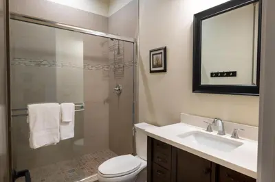 a bathroom with a toilet and a sink and a shower at Boulder Ridge in Yosemite West