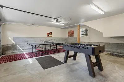 a room with two ping pong tables in it at Apple Tree Bear House in Yosemite West
