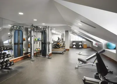 a gym with several treadmills and exercise equipment at The Residences at One Village Place by Hyatt Vacation Club in Truckee