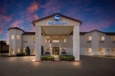 a building with a best western sign on the front at Best Western Liberty Inn in Delano