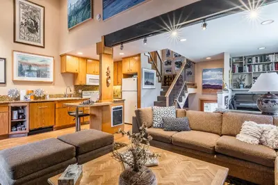 a living room with a couch and a table at Chamonix # 92 in Mammoth Lakes