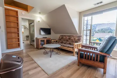 a living room with a couch and a table at Rainbow Ridge B - 1BR/1BA in June Lake