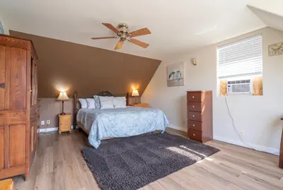 a bedroom with a bed and a ceiling fan at Rainbow Ridge B - 1BR/1BA in June Lake