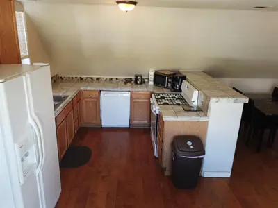 a kitchen with a stove and a counter top at Rainbow Ridge B - 1BR/1BA in June Lake
