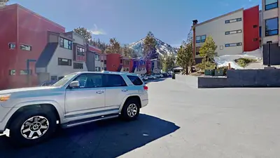 a silver truck parked in a parking lot at Comfortable 4 Bedroom Condo in Mammoth Lakes