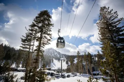 a ski lift going up a snowy mountain at Renovated 2 Bedroom Condo with Elevator Access! in Mammoth Lakes