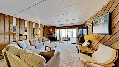 a living room with a couch and two chairs at Great 3 Bedroom Condo with Washer and Dryer! in Mammoth Lakes